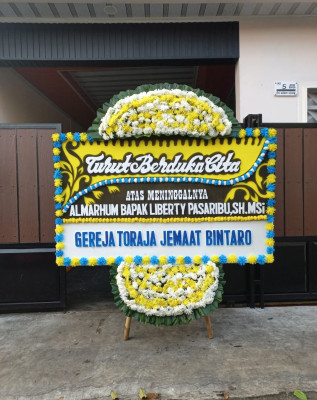 Papan Bunga Duka di Leksono